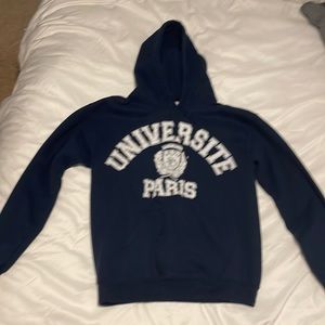 Navy blue hoodie worn